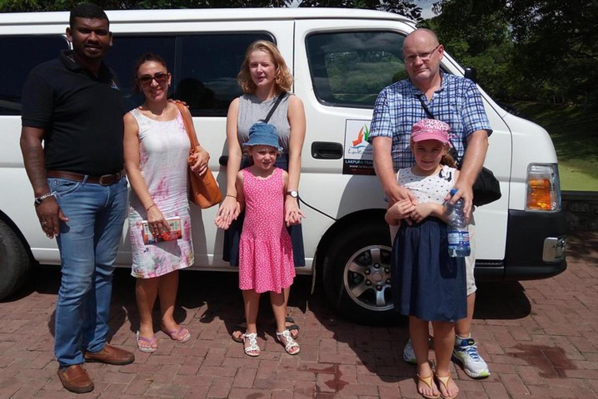 a group of people standing in front of a van