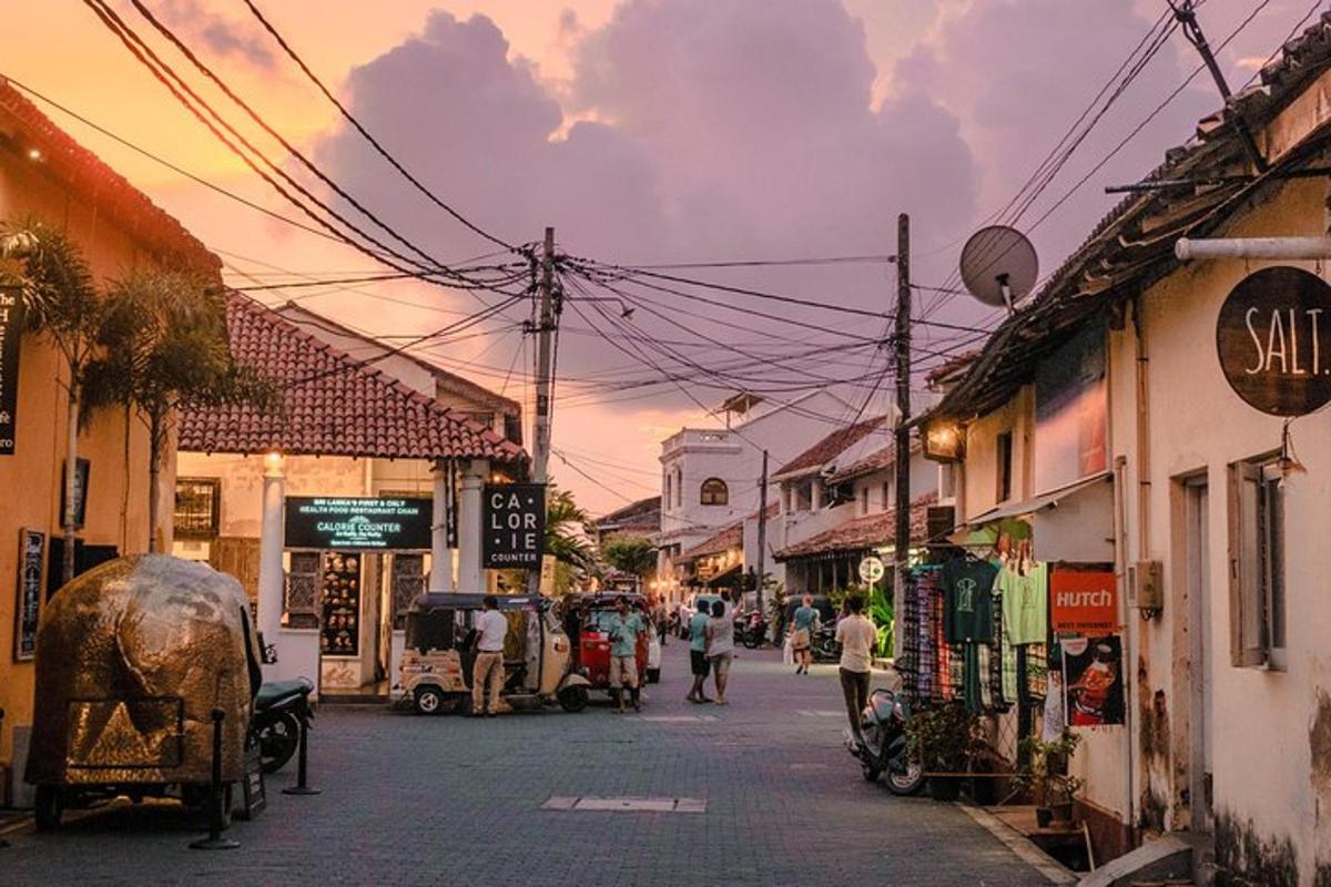 a city street with people walking down a street