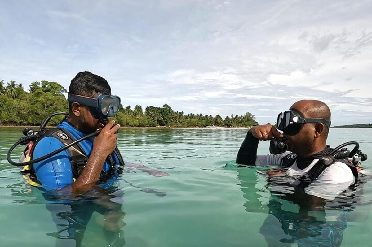 two men in the water wearing virtual reality glasses