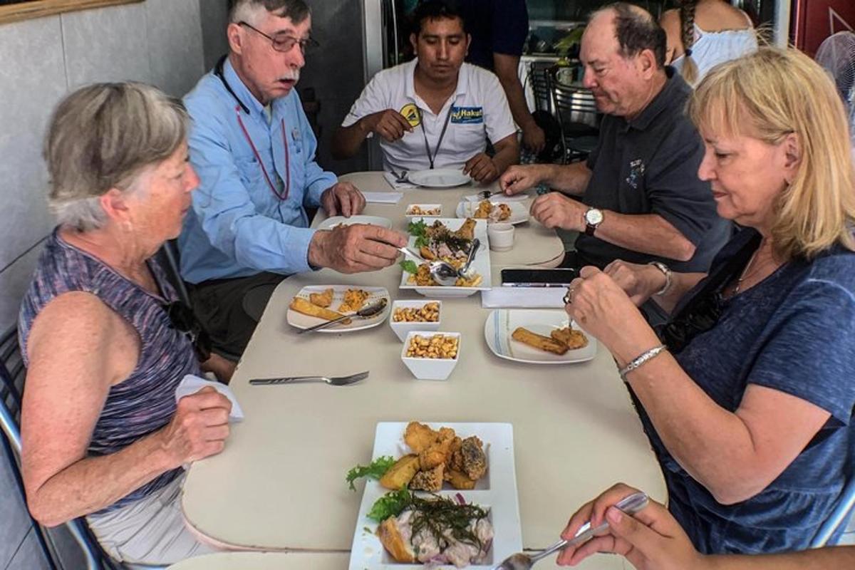 a group of people sitting around a table eating food