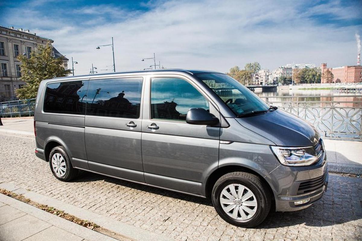 a silver van parked on the side of a street