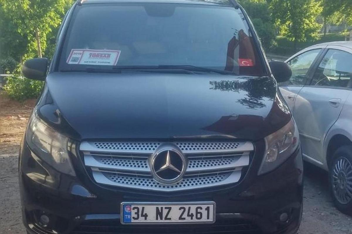 a black car parked in a parking lot
