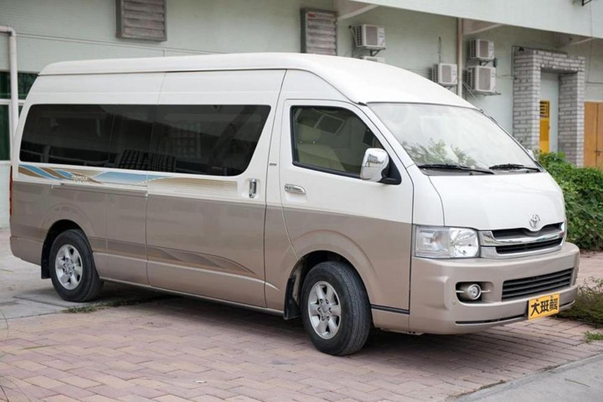 a white van is parked on a brick street