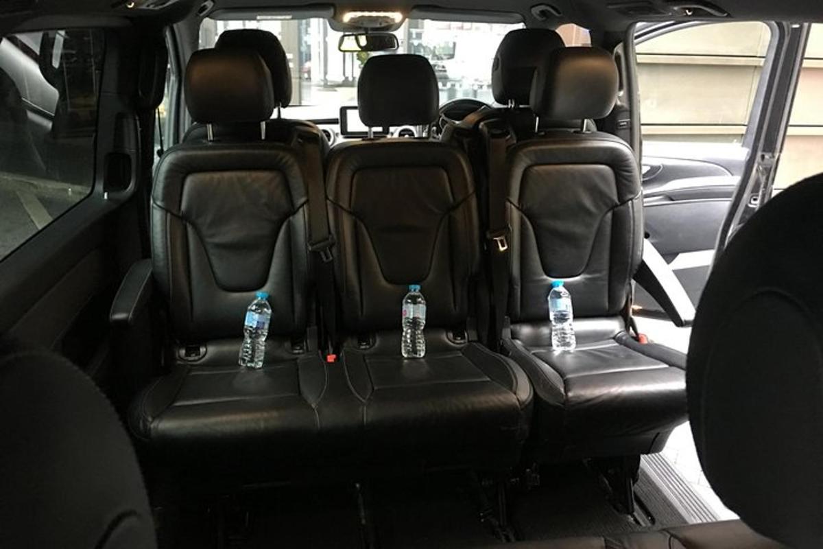 two bottles of water sitting in the back seats of a car