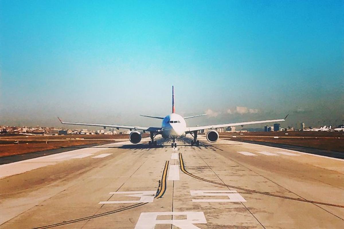 an airplane is sitting on an airport runway