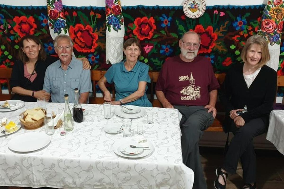 a group of people sitting around a table