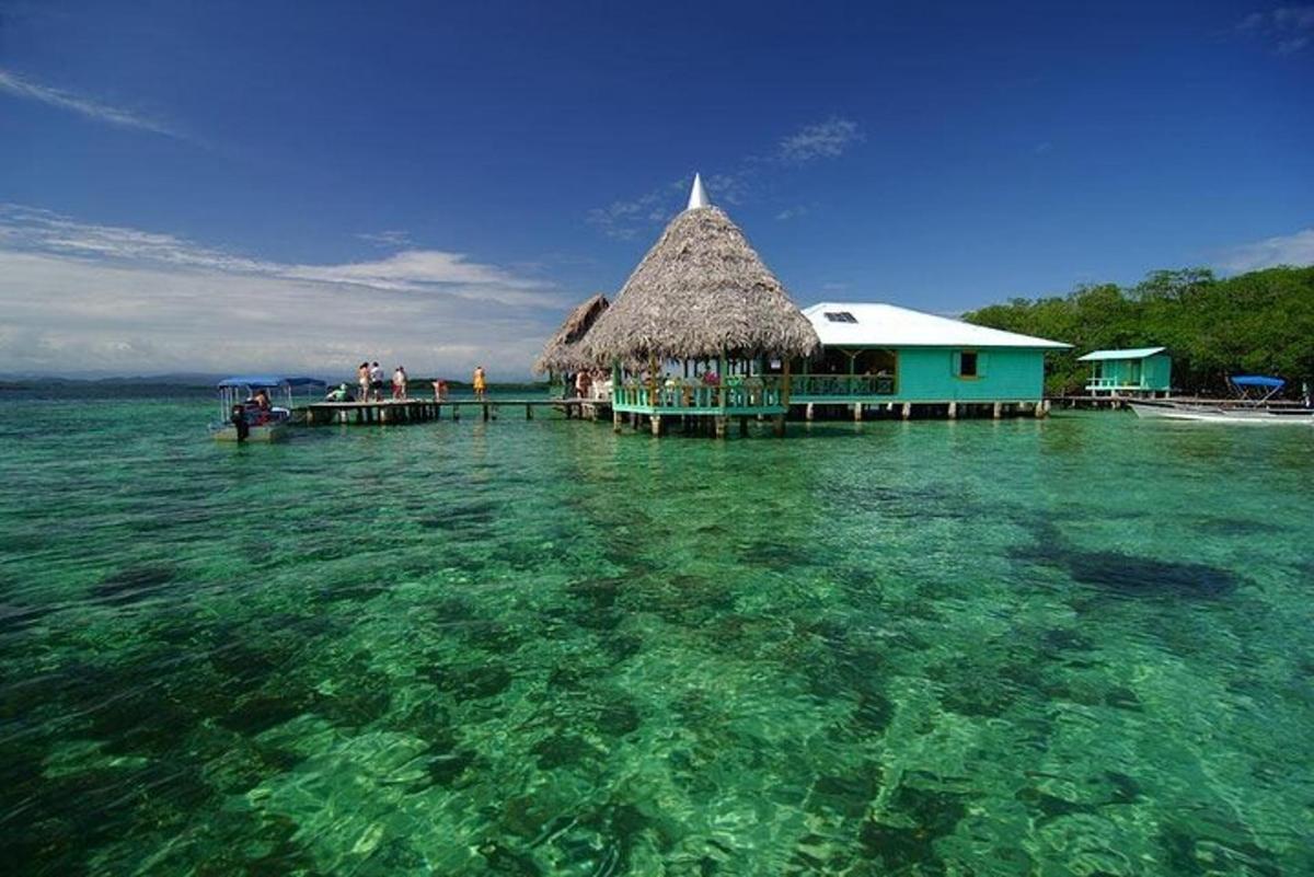 a building in the water next to the ocean