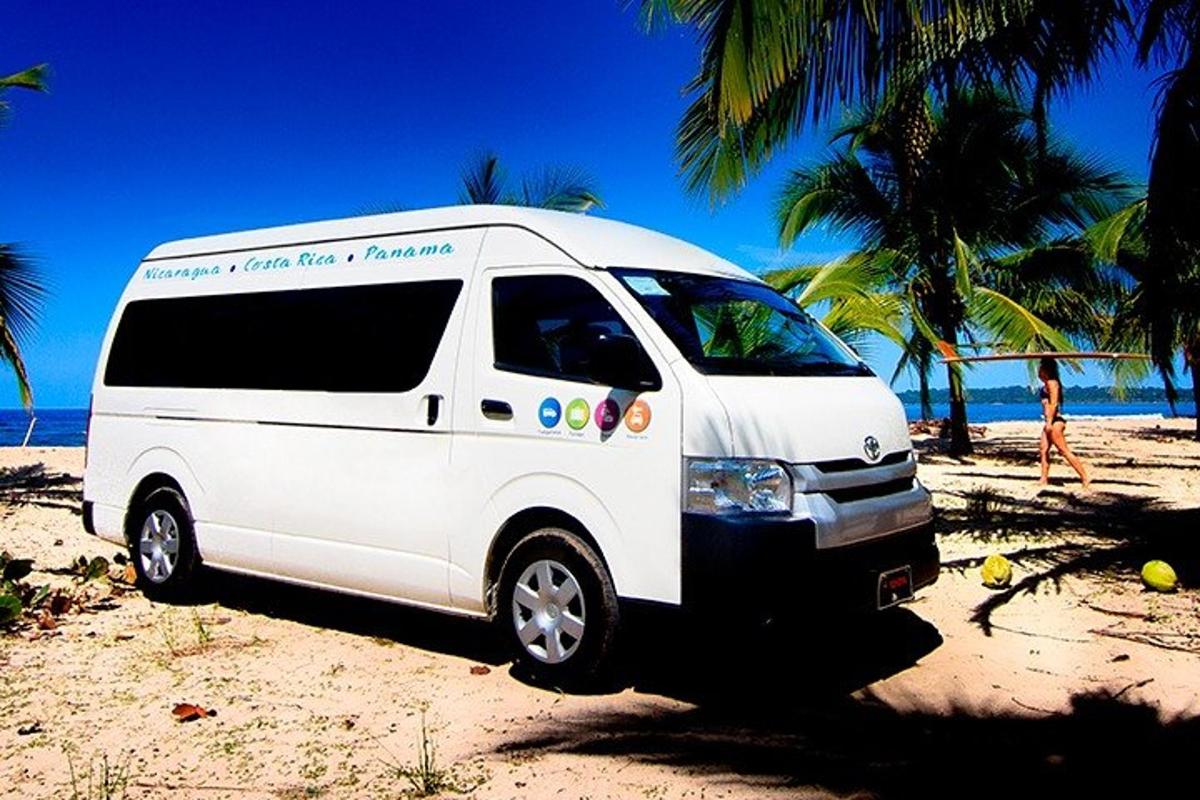a white van is parked on the beach
