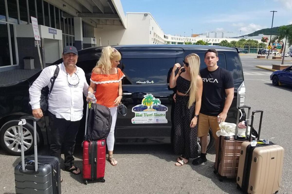 a group of people standing in front of a van
