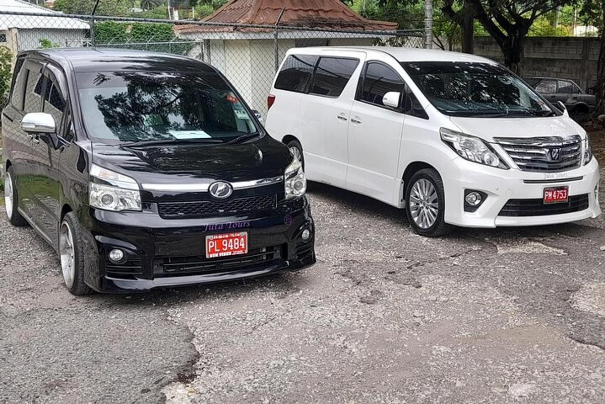 two white vans parked next to each other