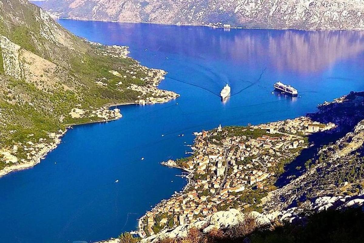 an aerial view of a large body of water with a boat