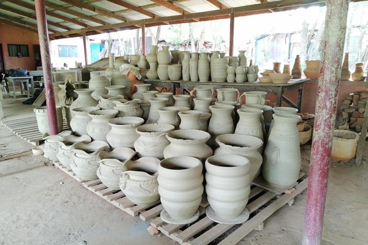 a bunch of vases sitting on a rack