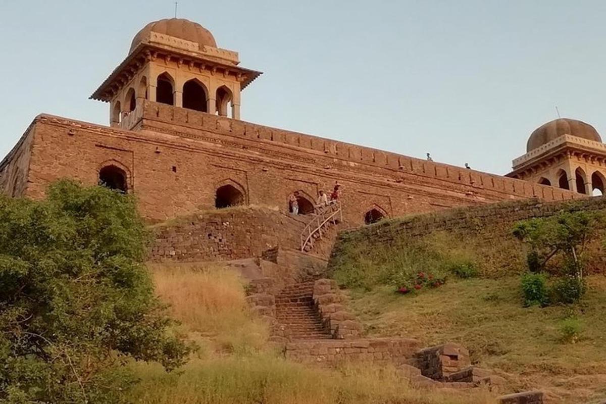 a large brick building with stairs in front of it