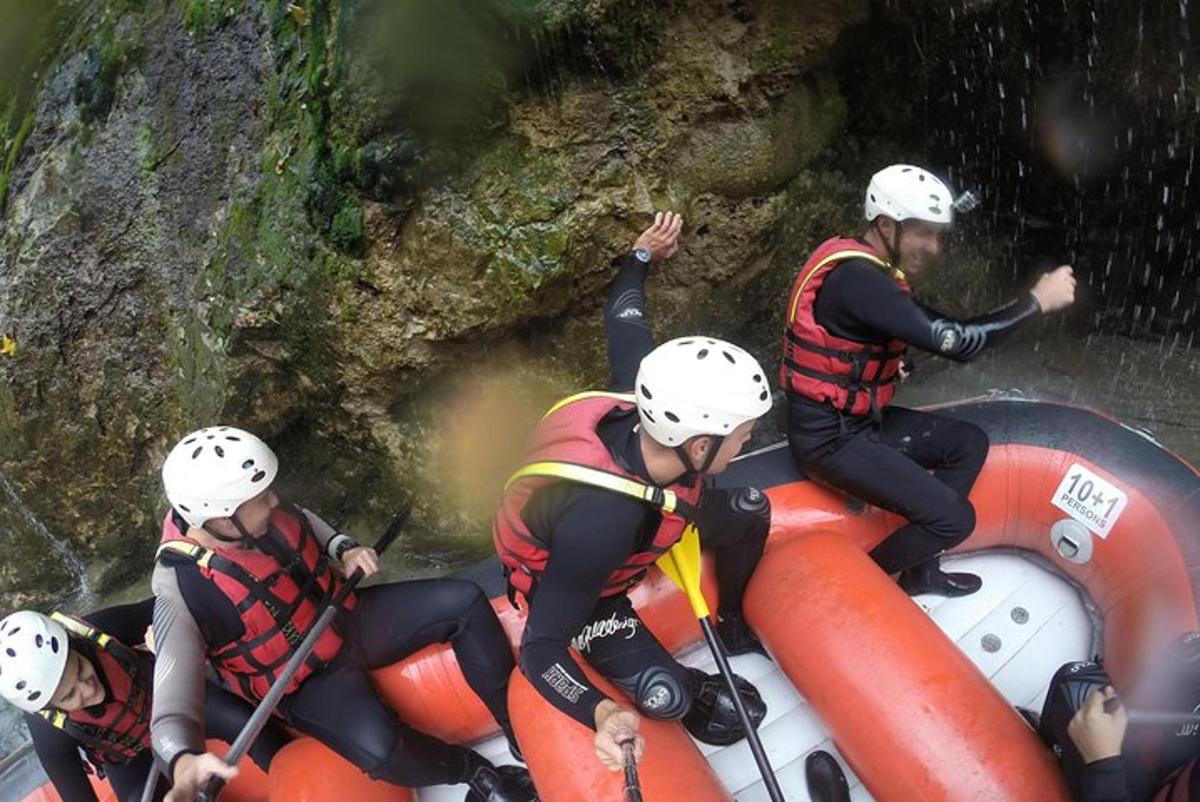 a group of people rafting down a river