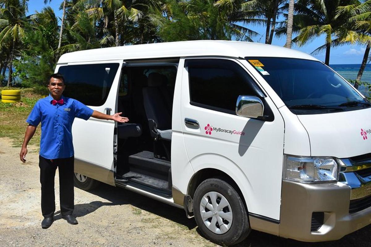 a man standing in front of a white van