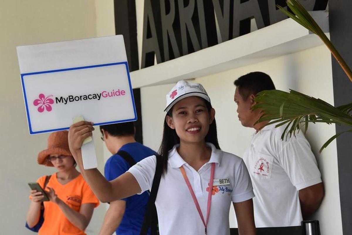 a girl holding up a sign in front of a group of people