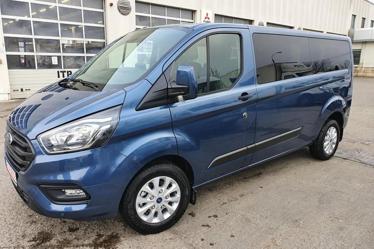 a blue van parked in a parking lot