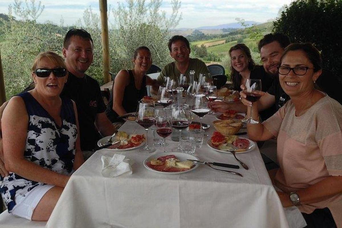 a group of people sitting at a table eating food