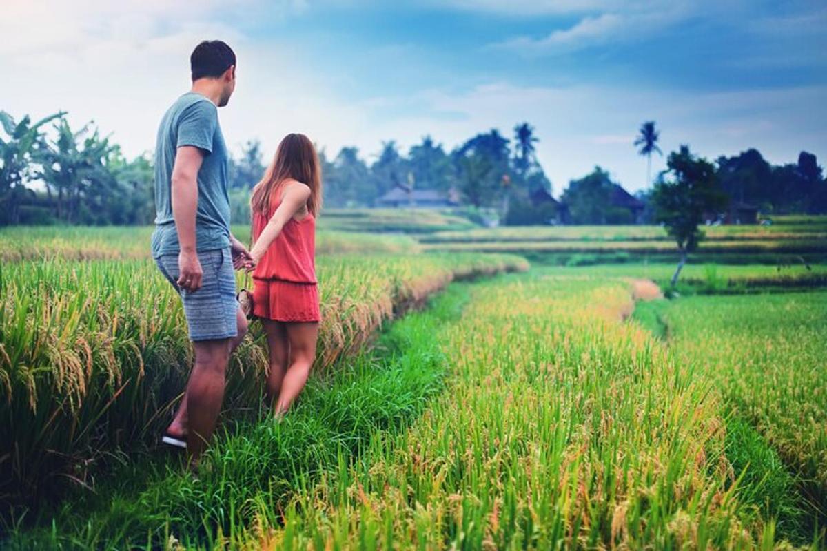 a man and a woman standing in a field