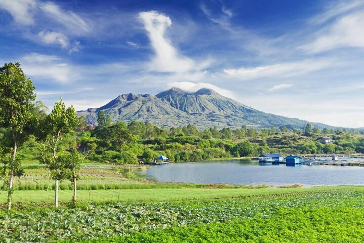 a mountain in the distance with a body of water