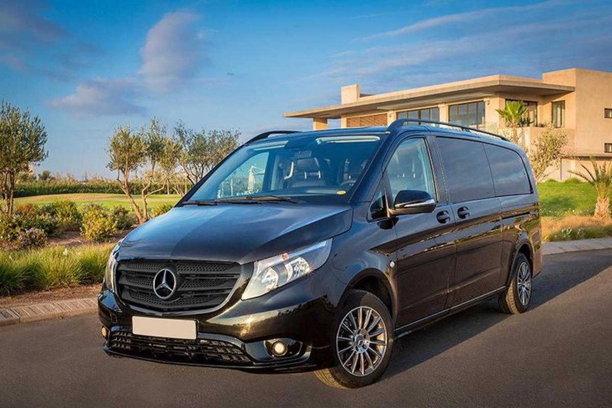 a black van parked in front of a house