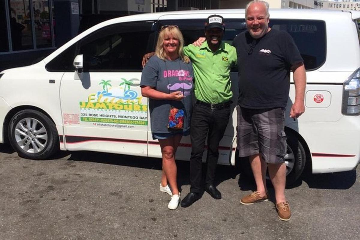 a group of people standing in front of a van