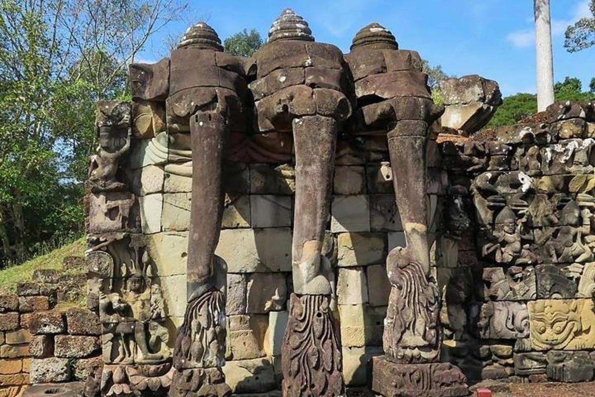 a stone building with statues on the side of it