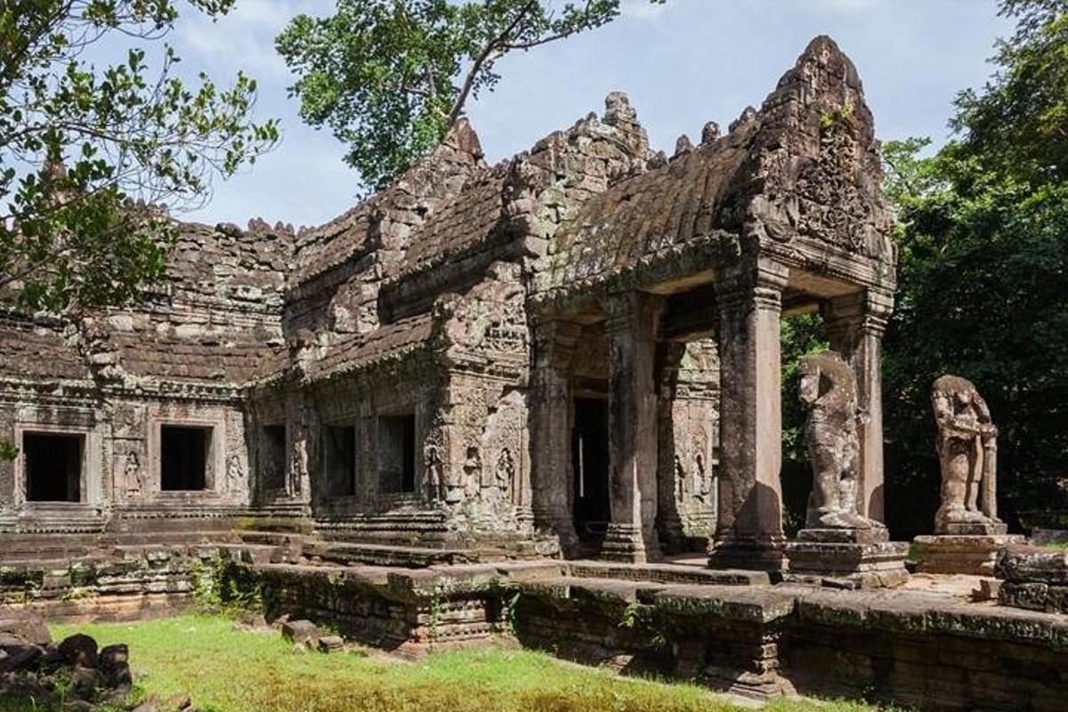 an old stone building with trees in the background