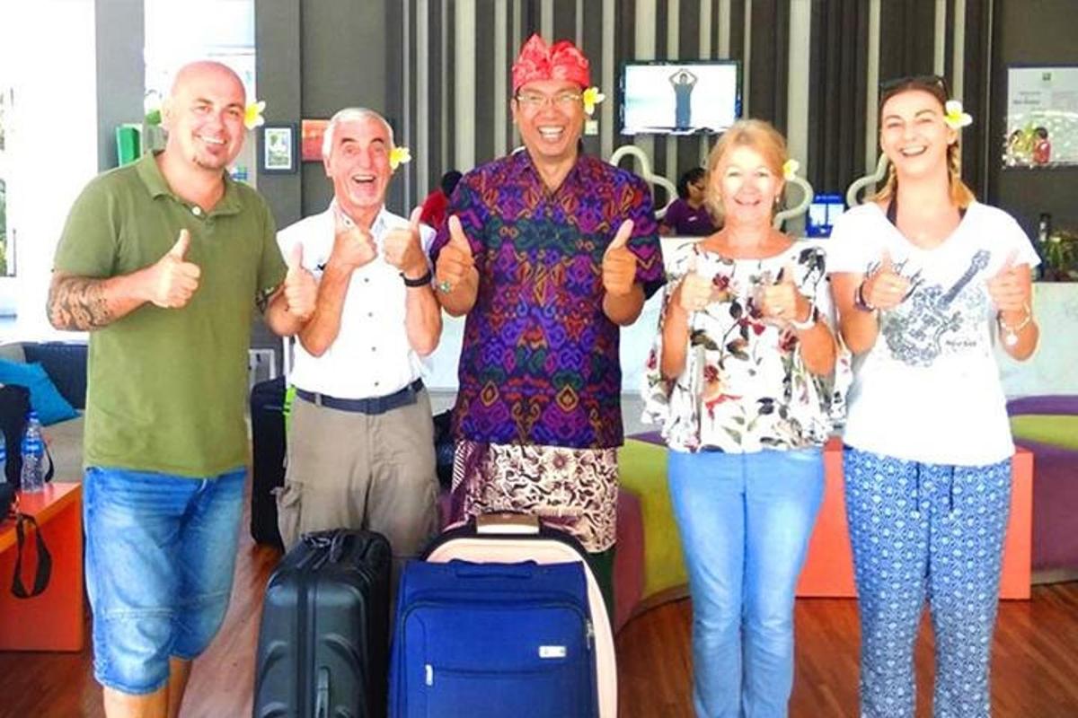 a group of people with their thumbs up at an airport