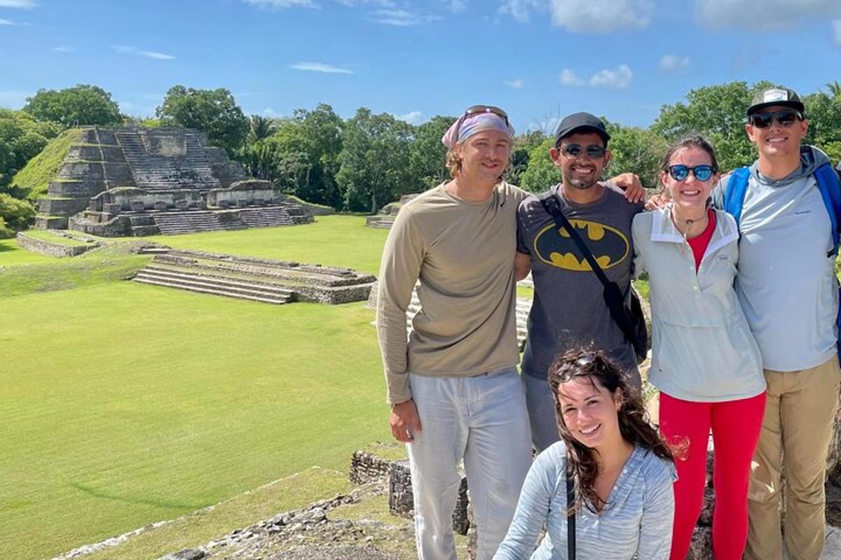 a group of people posing at the mayan ruins