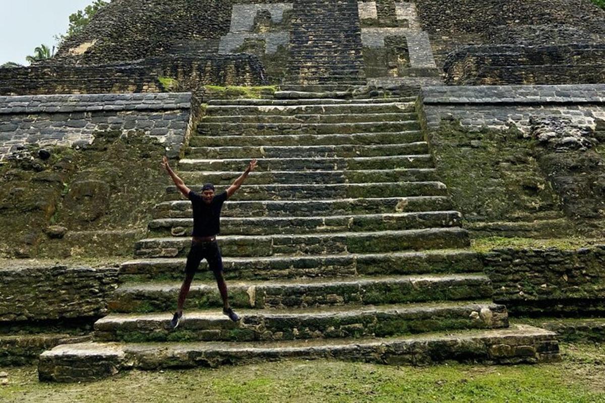 a person standing on some stairs with their arms in the air