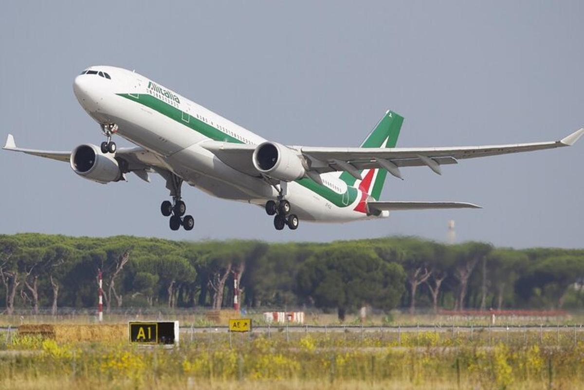 an airplane is taking off from an airport runway