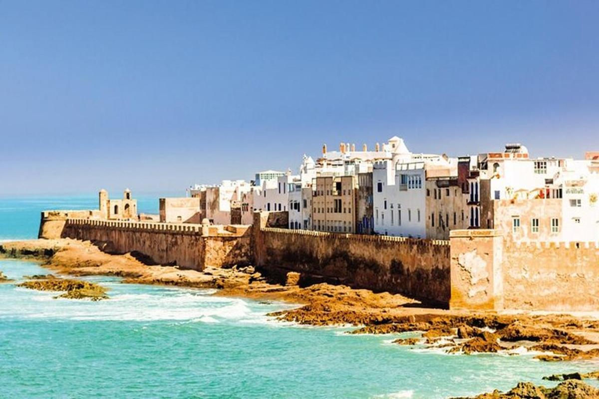 a group of buildings next to a body of water