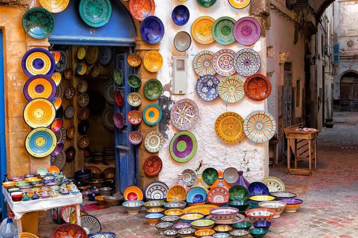 a display of colorful plates and bowls on a wall