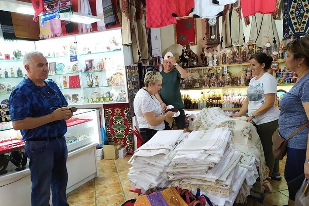 a group of people standing in a store with a counter