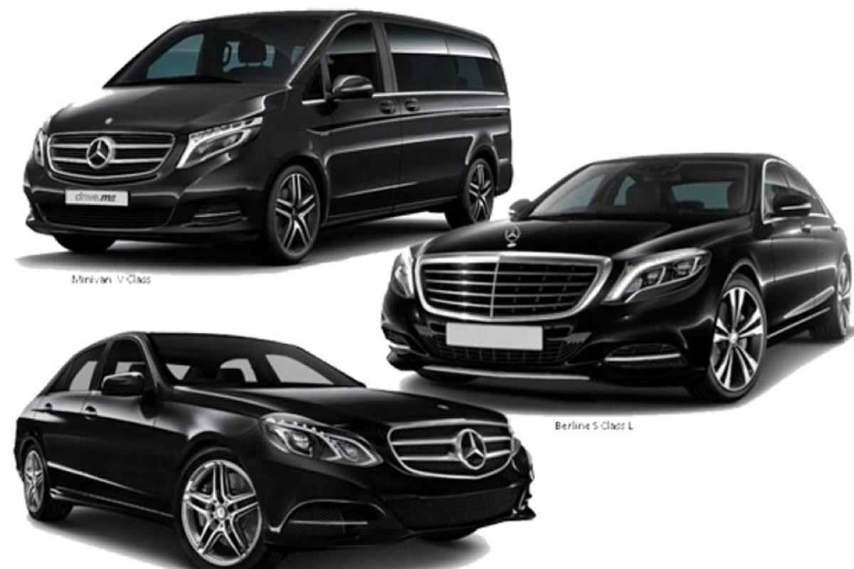 due auto nere e una limousine nera