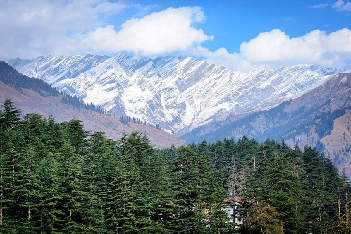 a view of a mountain range with snow covered mountains