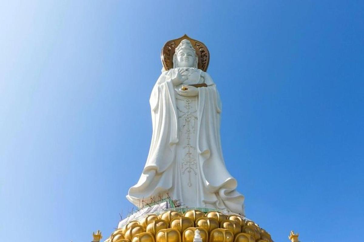 a large white statue on top of a building