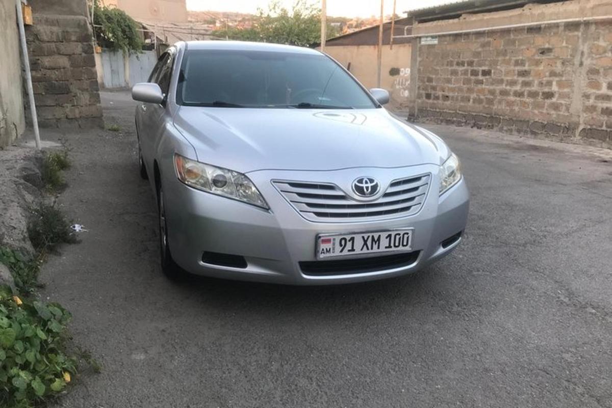 a silver car parked in a parking lot