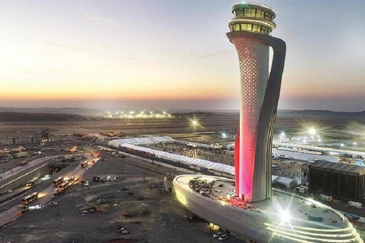 an image of an airport tower at night
