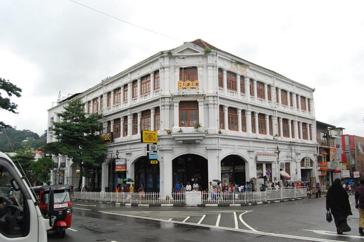 a large white building on the corner of a street