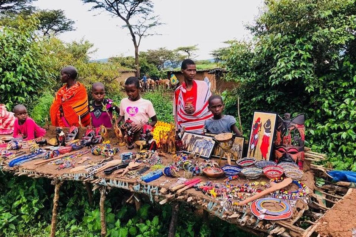 a group of people standing around a table with jewelry