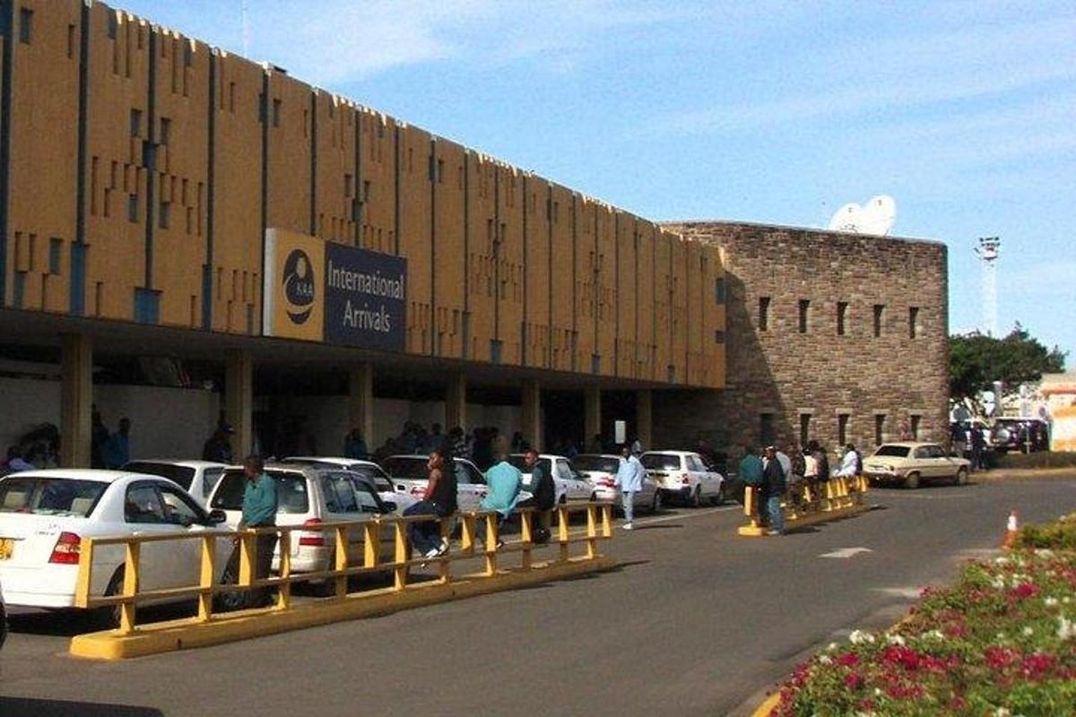 a building with cars parked in a parking lot