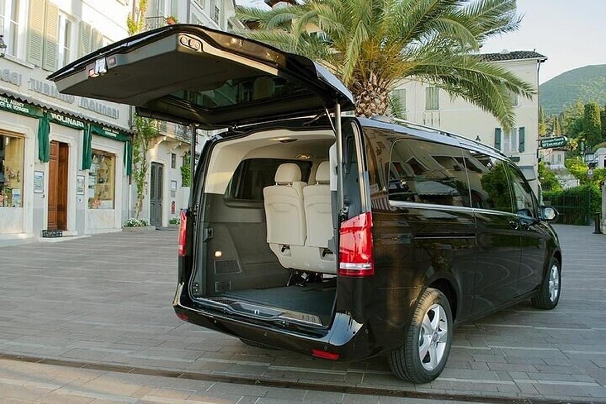 a black van with its door open on a street