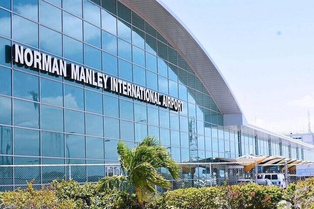 a large glass building with a sign on it