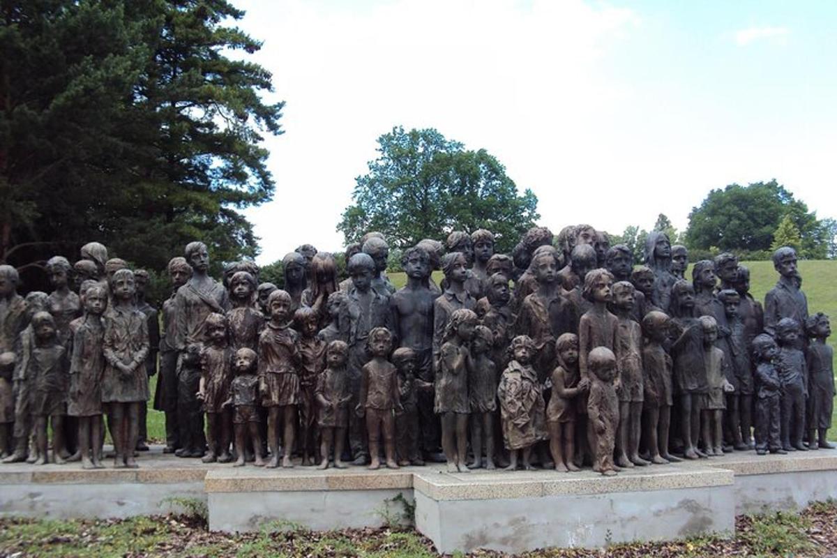 a statue of a group of children in a park