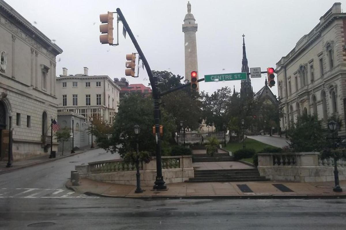 an intersection with a street sign and a traffic light