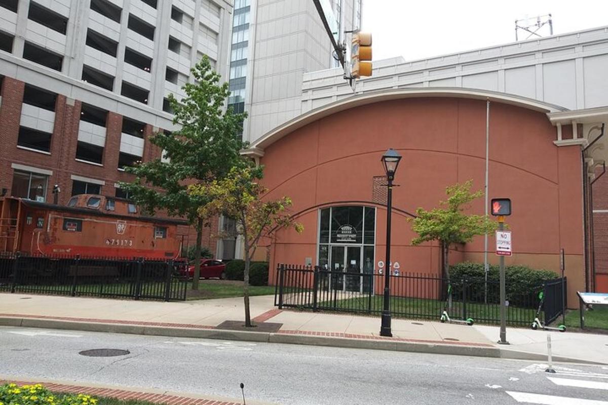 a red building with a train in a city