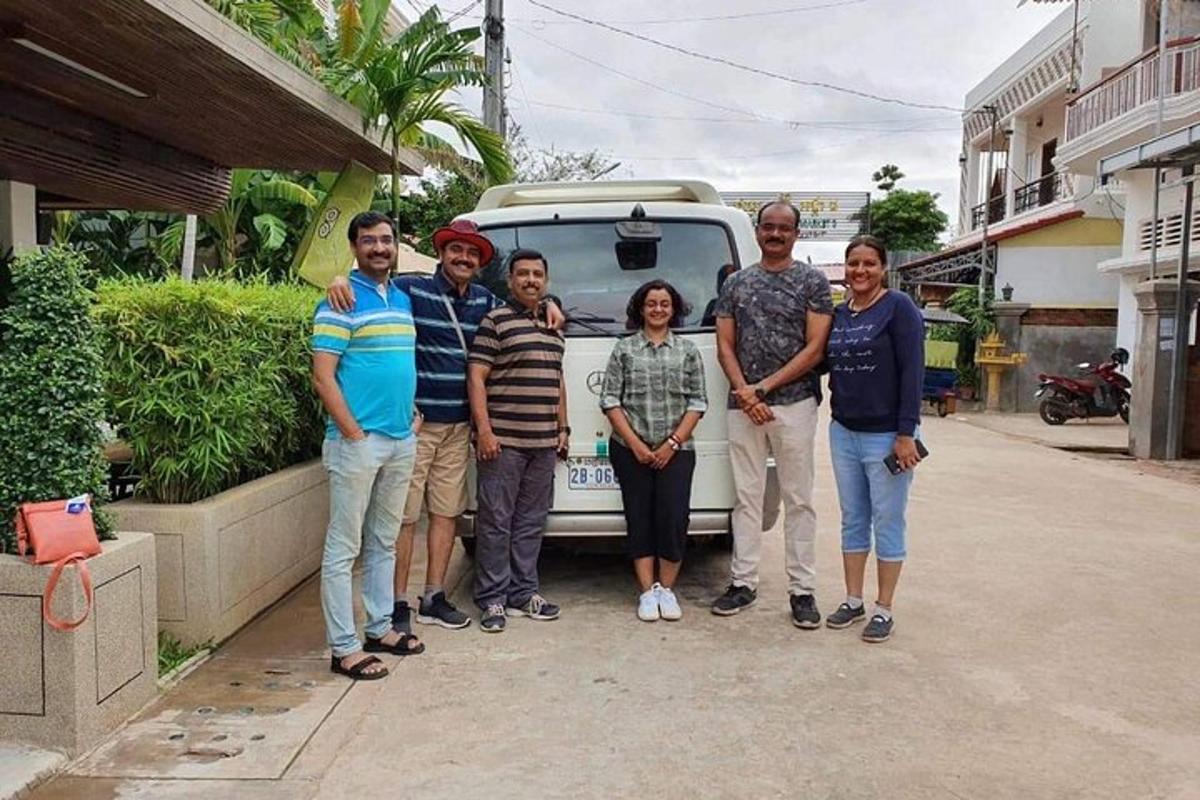 a group of people standing in front of a van