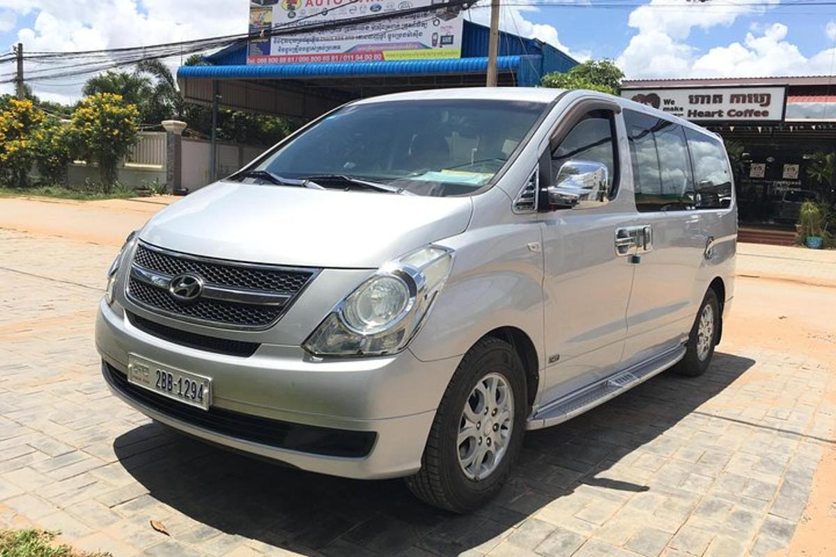 a white minivan parked on a street